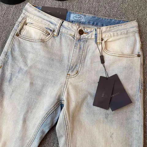 Prada triangle-logo denim jeans